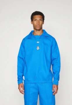 Adidas Originals REAL MADRID ICON - Article De Supporter D'équipe De Club - Blue Bird White -ASOS 3d43d45783b949808db57f3d9752d710