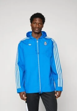 Adidas Originals REAL MADRID ICON PARKA - Article De Supporter D'équipe De Club - Bluebird/white -ASOS 6f4bdd68c6b84f6b91693f9cdad50157