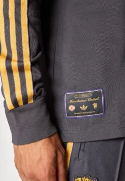 Adidas Originals MANCHESTER UNITED ICON LONG SLEEVE POLO - Article De Supporter D'équipe De Club - Utility Black -ASOS ee18370d775741ea8327784d53670be1